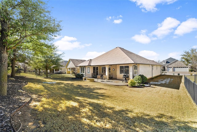 back of property featuring a patio and a lawn