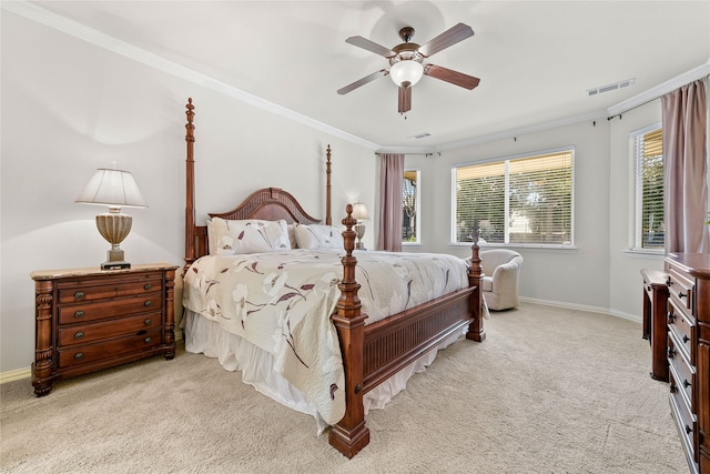 carpeted bedroom with ceiling fan, multiple windows, and crown molding