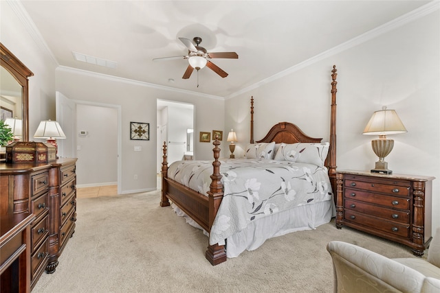 carpeted bedroom with ceiling fan, ensuite bathroom, and crown molding