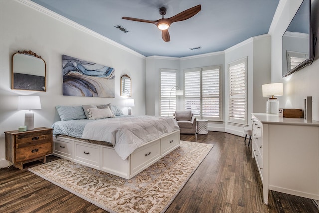 bedroom with dark hardwood / wood-style flooring, ceiling fan, and ornamental molding