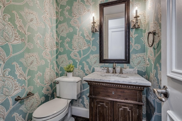 bathroom with toilet and vanity