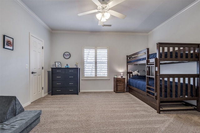 bedroom with carpet floors, ceiling fan, and crown molding