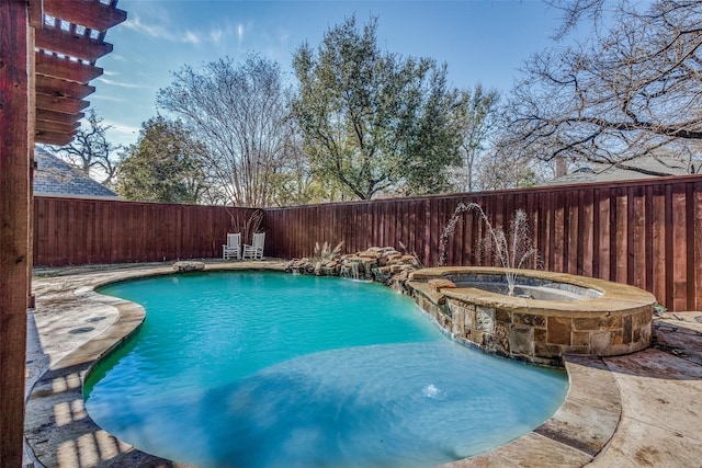 view of swimming pool with an in ground hot tub