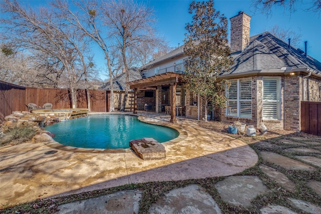 view of pool with a patio area and an in ground hot tub