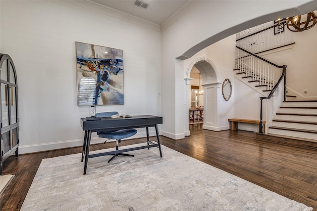 office area featuring an inviting chandelier, ornamental molding, and dark hardwood / wood-style floors