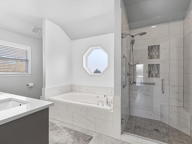 bathroom featuring vanity, plus walk in shower, and tile patterned flooring