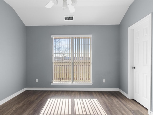 spare room with dark wood-type flooring, ceiling fan, and lofted ceiling