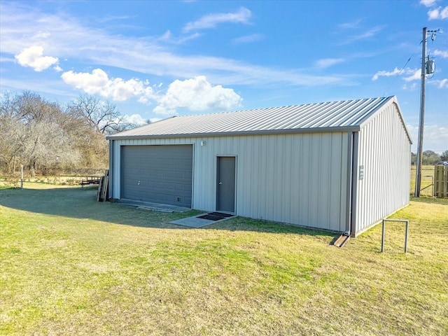 garage featuring a lawn