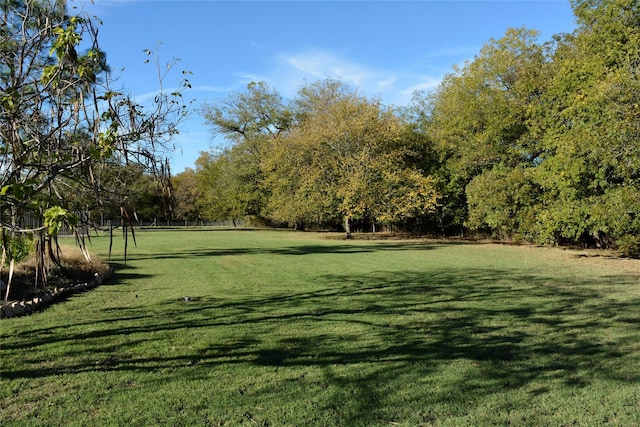 view of home's community featuring a lawn