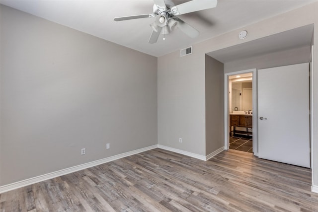 unfurnished room featuring ceiling fan and light hardwood / wood-style floors