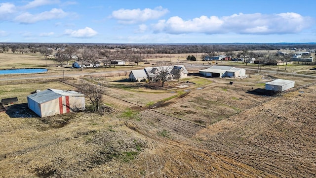 bird's eye view featuring a water view and a rural view