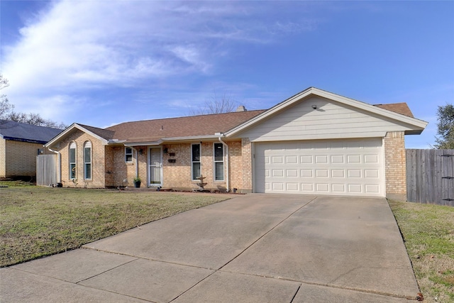 ranch-style house featuring a front lawn and a garage