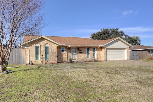 ranch-style home with a front yard and a garage