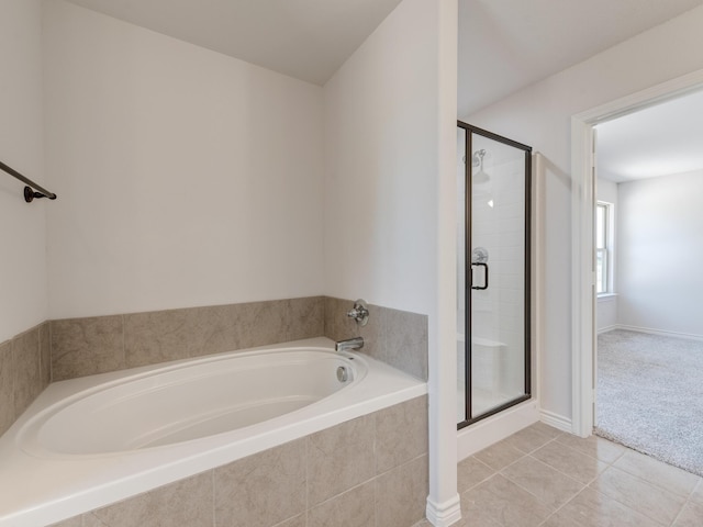 bathroom with tile patterned floors and plus walk in shower