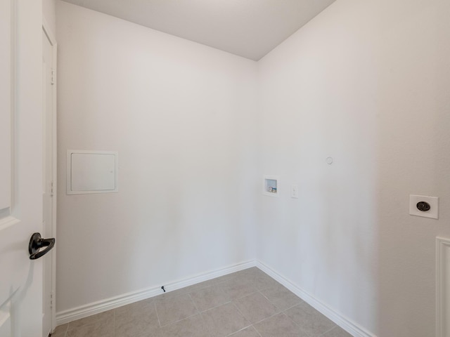 laundry area with light tile patterned floors, hookup for a washing machine, and hookup for an electric dryer