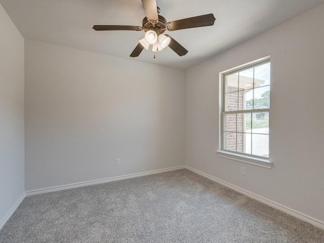 empty room with ceiling fan and carpet