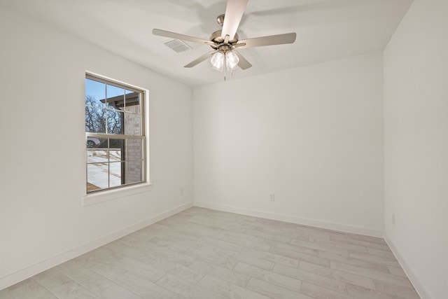 empty room featuring ceiling fan and light hardwood / wood-style floors