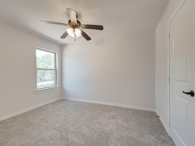 unfurnished room featuring ceiling fan and light carpet