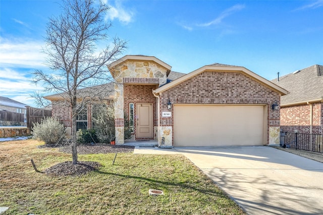 view of front of property with a front lawn and a garage