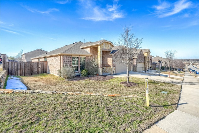 ranch-style home featuring a garage and a front yard