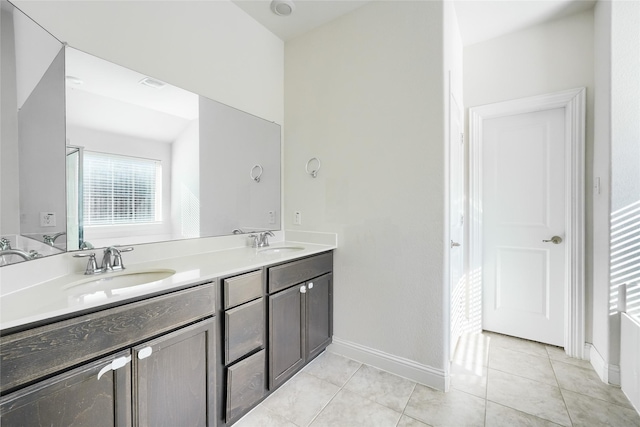 bathroom with tile patterned flooring and vanity