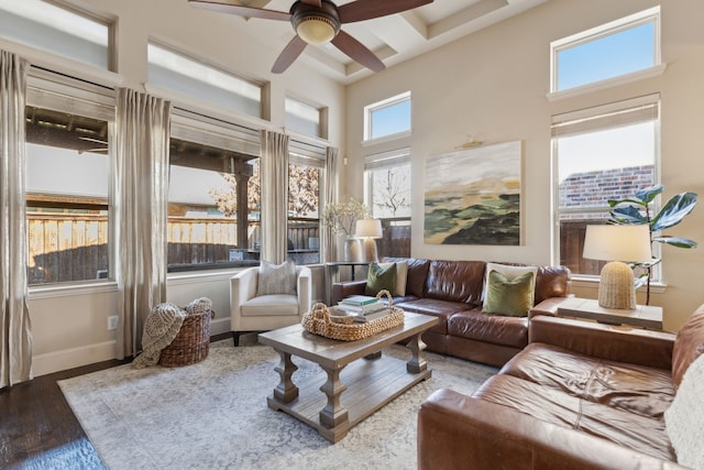 sunroom featuring ceiling fan and a healthy amount of sunlight