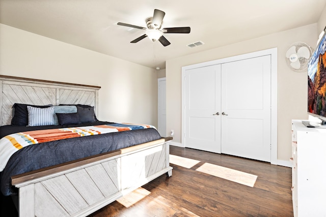 bedroom featuring a closet, ceiling fan, and dark wood-type flooring