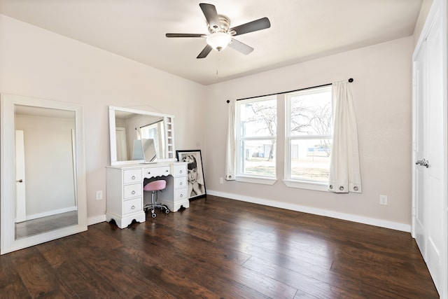 bedroom with dark hardwood / wood-style flooring and ceiling fan