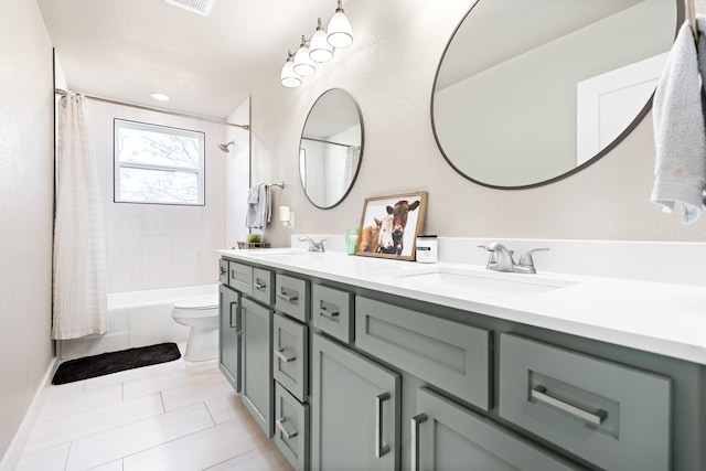 full bathroom featuring toilet, tile patterned flooring, shower / bath combo with shower curtain, and vanity