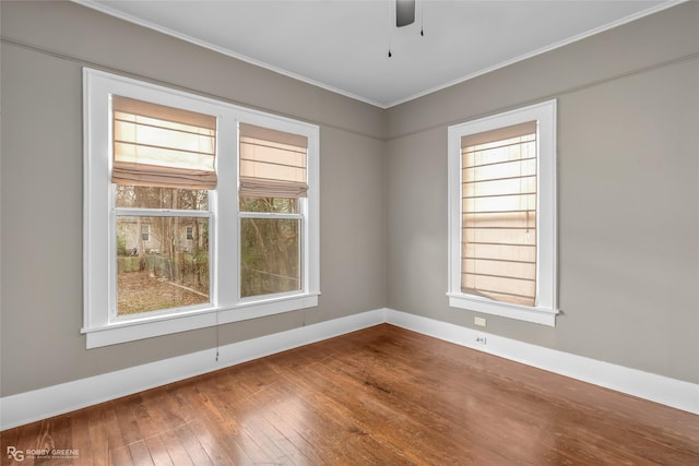 unfurnished room with ceiling fan, ornamental molding, and hardwood / wood-style flooring