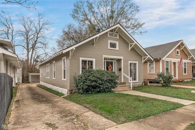 bungalow-style house with a front yard