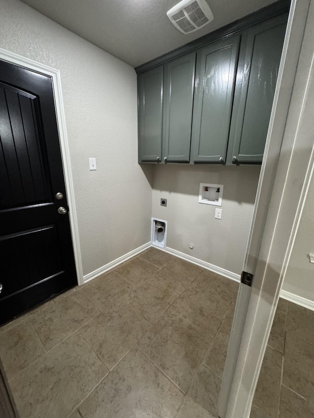 laundry room featuring cabinets, hookup for a washing machine, hookup for a gas dryer, and hookup for an electric dryer