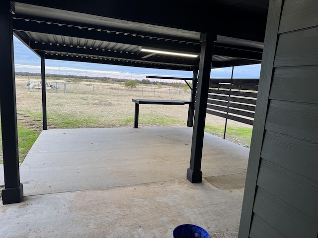 view of patio with a rural view