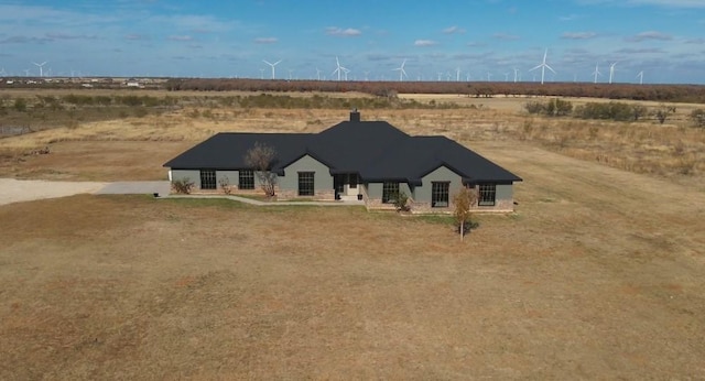 view of front of property with a rural view