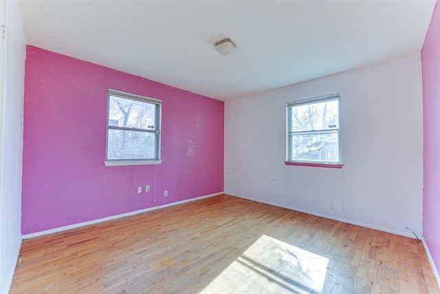 unfurnished room featuring light hardwood / wood-style flooring