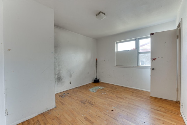 spare room featuring light hardwood / wood-style floors