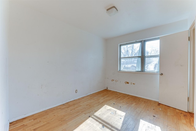 unfurnished room with light hardwood / wood-style floors