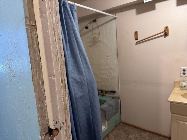 bathroom with curtained shower and vanity