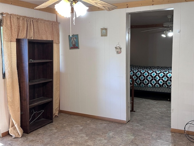 hall featuring wood walls