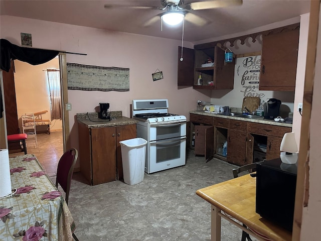 kitchen featuring ceiling fan and double oven range