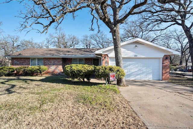 single story home featuring a front yard and a garage