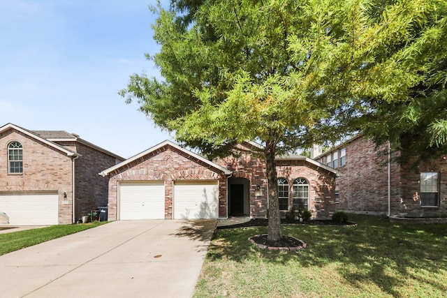 view of front of home featuring a front lawn and a garage