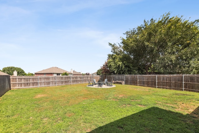 view of yard featuring an outdoor fire pit