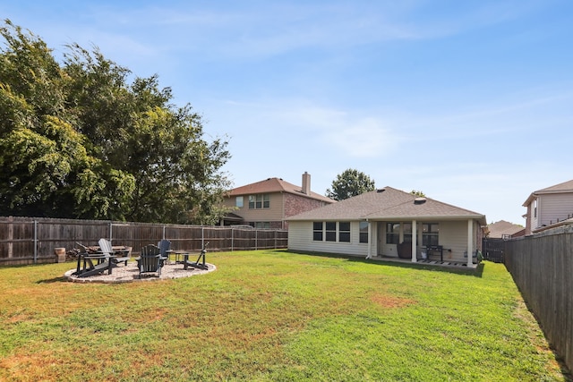 view of yard with an outdoor fire pit and a patio