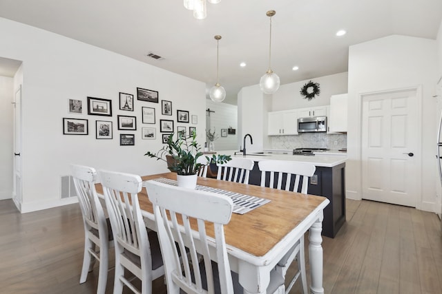 dining room featuring hardwood / wood-style floors and sink