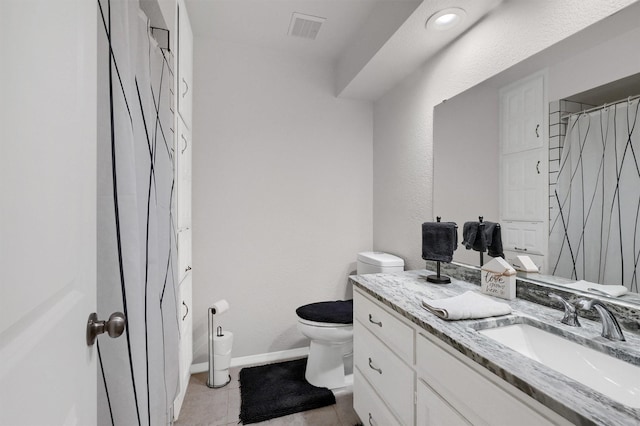 bathroom with toilet, curtained shower, tile patterned floors, and vanity