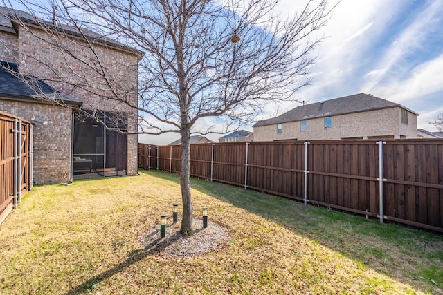 view of yard with a sunroom