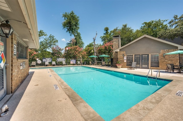 view of pool featuring a patio