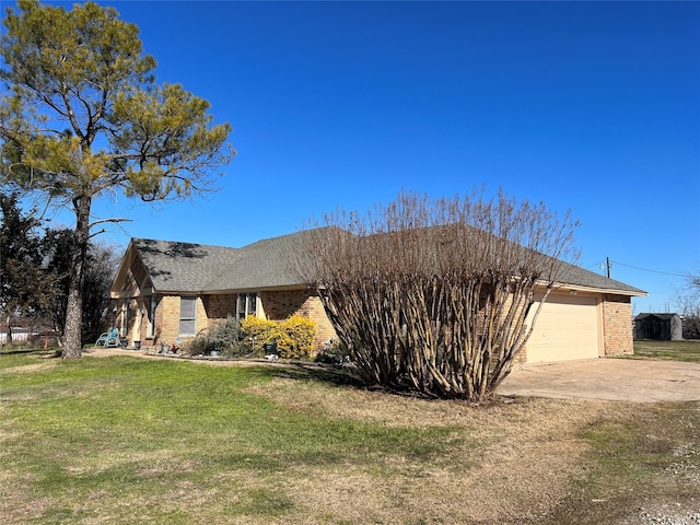 view of front of home with a garage and a front yard