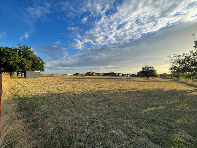 view of yard with a rural view